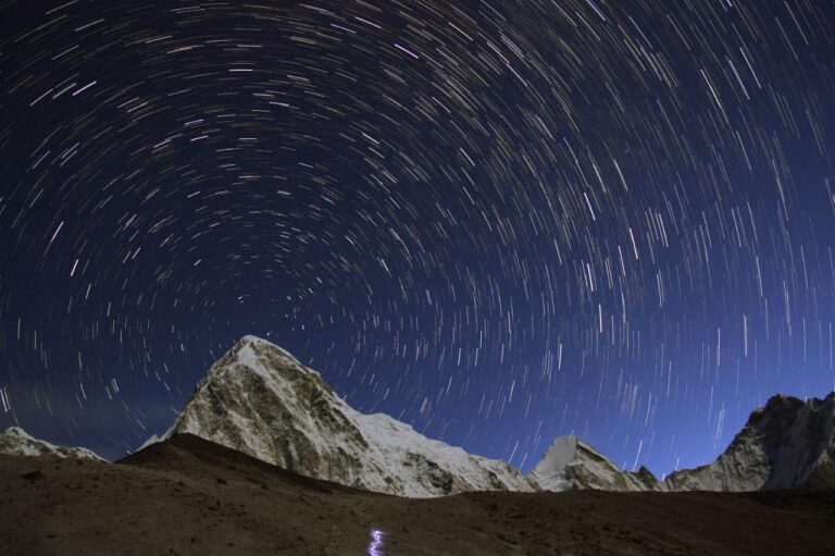 Star trails around the north pole as seen behind Pumori mountain (7161m) from Gorakshep, Nepal (5164m).
